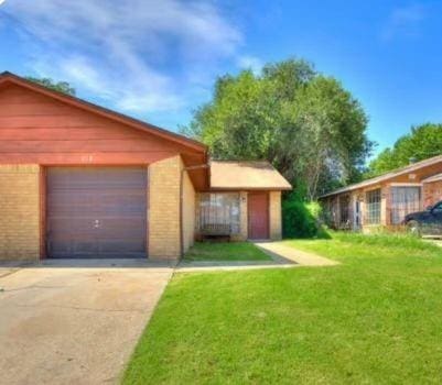218 Windsor Way, Midwest City, OK 73110 - garage with concrete driveway