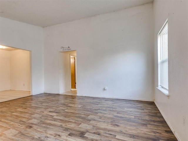 218 Windsor Way, Midwest City, OK 73110 - unfurnished room featuring healthy amount of natural light and wood finished floors