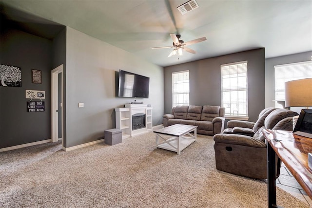 2500 SE 93rd St, Moore, OK 73160 - carpeted living room featuring ceiling fan and a glass covered fireplace