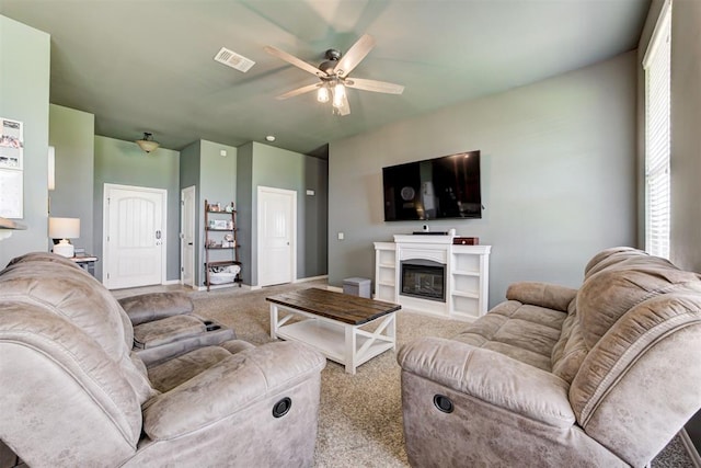 2500 SE 93rd St, Moore, OK 73160 - living area with carpet, ceiling fan, and a glass covered fireplace
