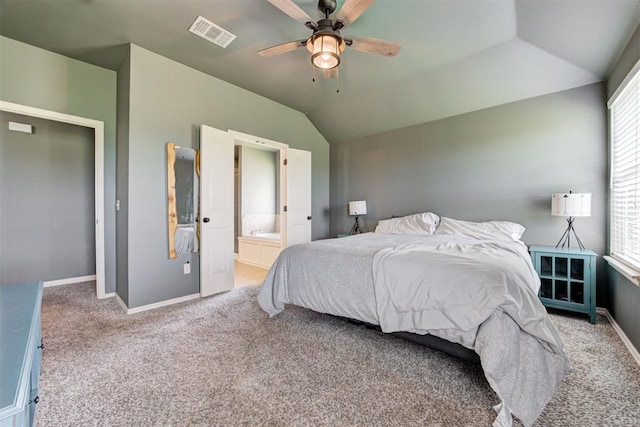 2500 SE 93rd St, Moore, OK 73160 - carpeted bedroom featuring vaulted ceiling, ensuite bathroom, and a ceiling fan
