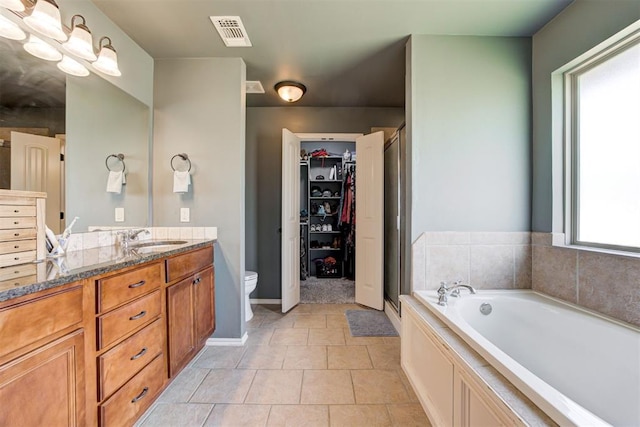 2500 SE 93rd St, Moore, OK 73160 - full bath with vanity, a garden tub, a spacious closet, a stall shower, and tile patterned flooring
