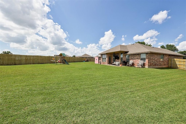 2500 SE 93rd St, Moore, OK 73160 - fenced backyard featuring a playground