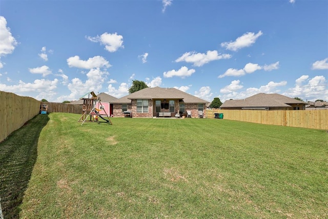 2500 SE 93rd St, Moore, OK 73160 - back of house featuring a playground and a fenced backyard
