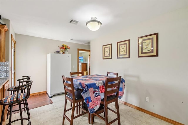 720 N Main St, Blanchard, OK 73010 - dining space featuring light tile patterned floors and baseboards