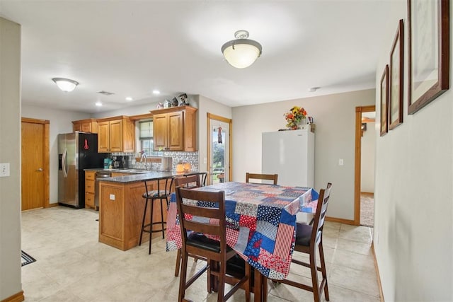 720 N Main St, Blanchard, OK 73010 - dining space featuring baseboards and recessed lighting