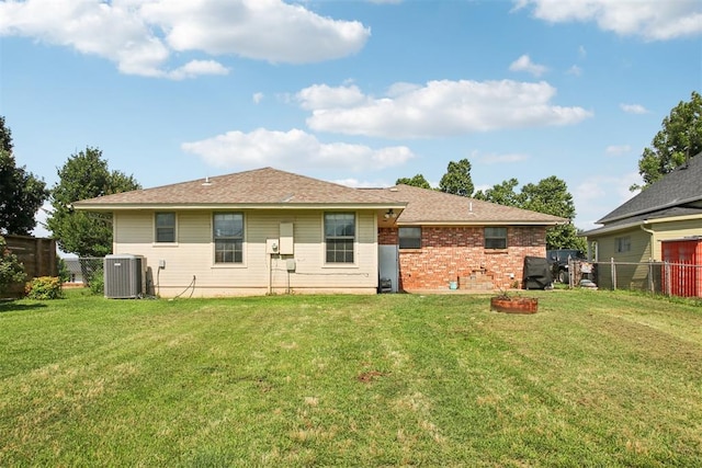 720 N Main St, Blanchard, OK 73010 - rear view of house featuring a fenced backyard and brick siding