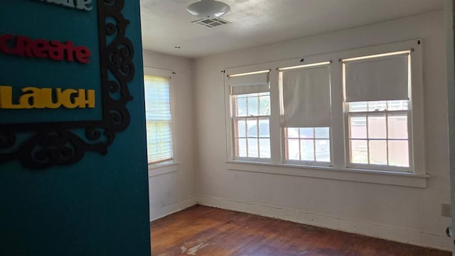 2609 NW 14th St, Oklahoma City, OK 73107 - spare room featuring wood finished floors and baseboards