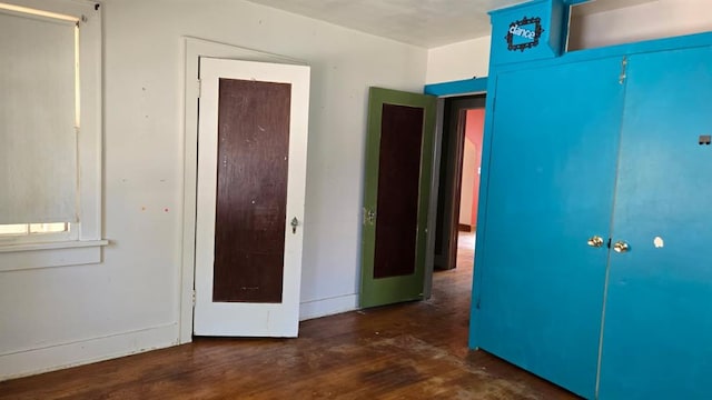 2609 NW 14th St, Oklahoma City, OK 73107 - unfurnished bedroom with wood finished floors and baseboards