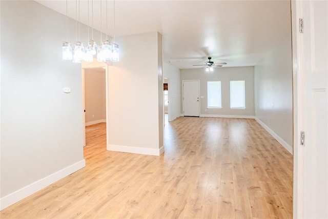 621 SW 7th St, Moore, OK 73160 - empty room featuring a ceiling fan and light wood-style flooring