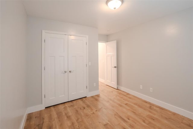 621 SW 7th St, Moore, OK 73160 - unfurnished bedroom with light wood finished floors and a closet