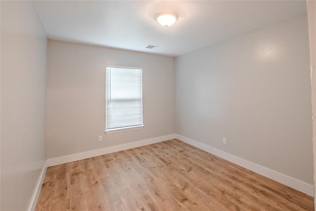 621 SW 7th St, Moore, OK 73160 - empty room with baseboards and light wood-style floors