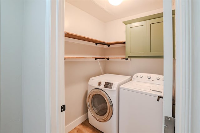 621 SW 7th St, Moore, OK 73160 - laundry room featuring cabinet space, washer and dryer, and light wood finished floors
