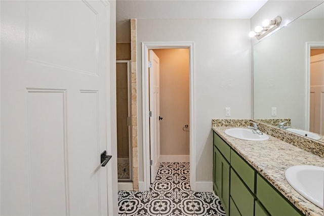 621 SW 7th St, Moore, OK 73160 - full bathroom with a shower stall, double vanity, and tile patterned floors