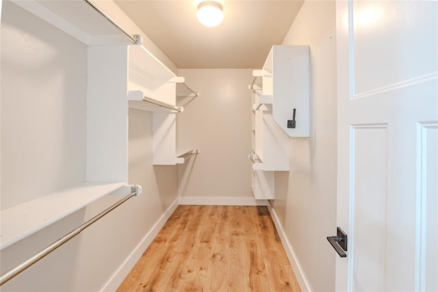 621 SW 7th St, Moore, OK 73160 - spacious closet with light wood-style floors