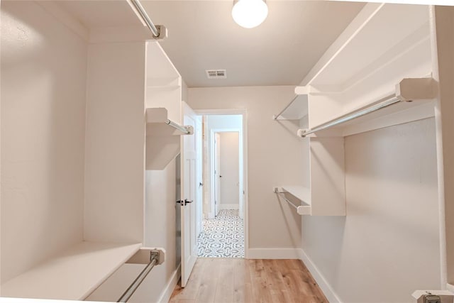 621 SW 7th St, Moore, OK 73160 - spacious closet featuring light wood-style flooring