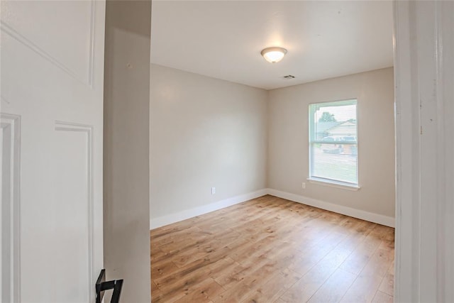 621 SW 7th St, Moore, OK 73160 - empty room with baseboards and wood finished floors