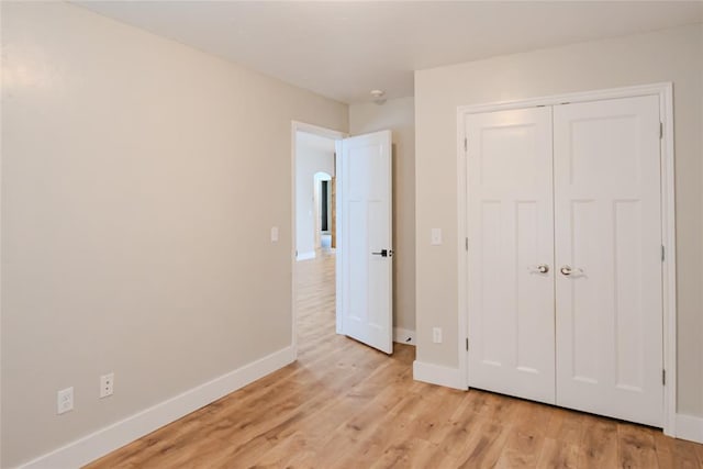 621 SW 7th St, Moore, OK 73160 - unfurnished bedroom featuring light wood-style flooring and a closet