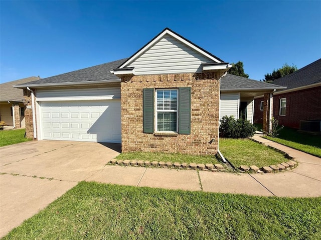 5913 SE 67th St, Oklahoma City, OK 73135 - ranch-style house featuring driveway, brick siding, an attached garage, a front lawn, and roof with shingles