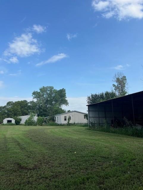 2800 Durango Cir, Yukon, OK 73099 - view of grassy yard with a pole building and an outdoor structure