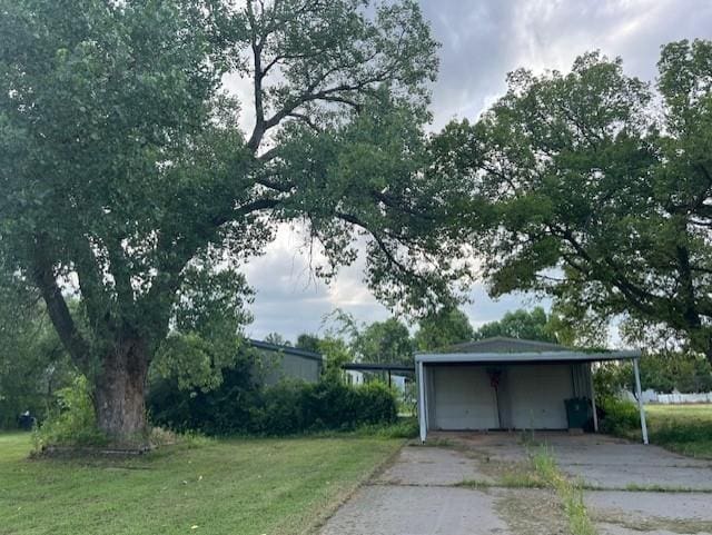 2800 Durango Cir, Yukon, OK 73099 - garage with driveway and a detached garage