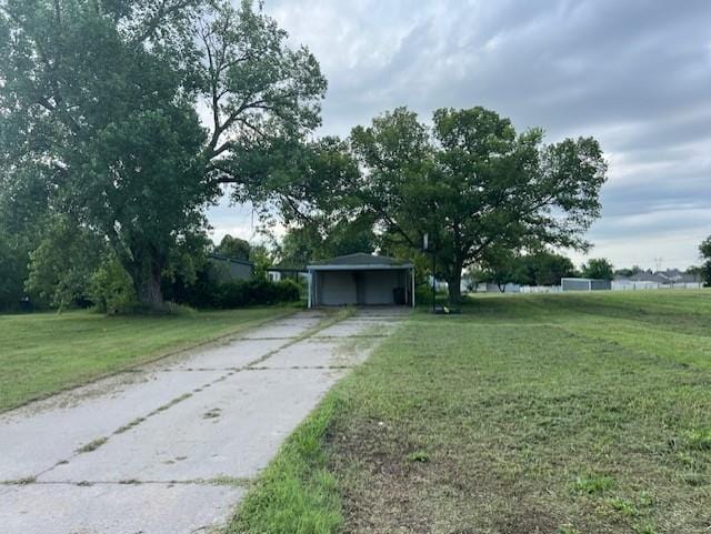 2800 Durango Cir, Yukon, OK 73099 - view of front of house with a detached garage, a front lawn, and driveway