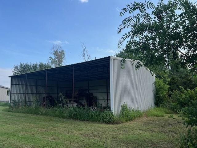 2800 Durango Cir, Yukon, OK 73099 - view of pole building featuring a yard and a detached carport