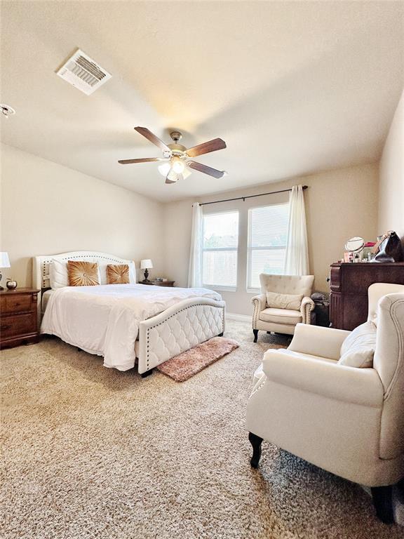 9524 SW 26th St, Oklahoma City, OK 73128 - carpeted bedroom featuring a ceiling fan