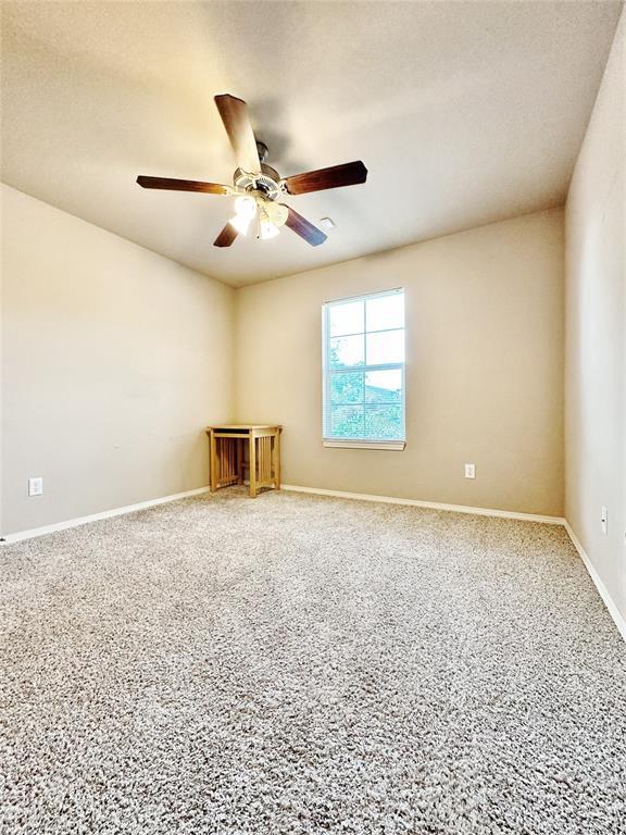 9524 SW 26th St, Oklahoma City, OK 73128 - spare room with ceiling fan and baseboards