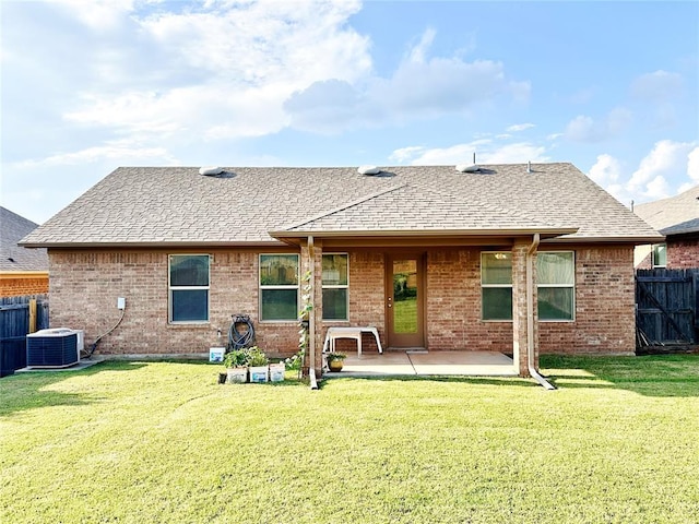 9524 SW 26th St, Oklahoma City, OK 73128 - rear view of property featuring a patio, brick siding, and a shingled roof