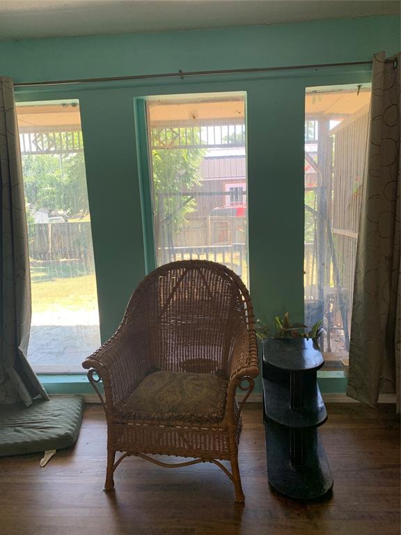 123 N Payne St, Fort Cobb, OK 73038 - living area featuring wood finished floors and healthy amount of natural light