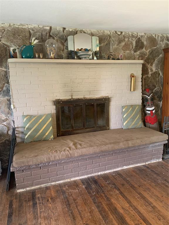 123 N Payne St, Fort Cobb, OK 73038 - detailed view of a fireplace and wood finished floors