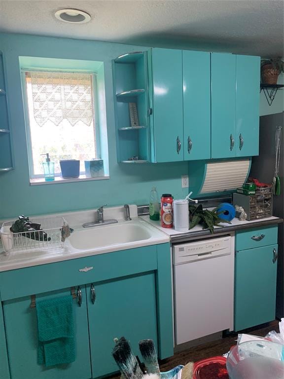 123 N Payne St, Fort Cobb, OK 73038 - kitchen featuring white dishwasher, open shelves, a textured ceiling, light countertops, and blue cabinets