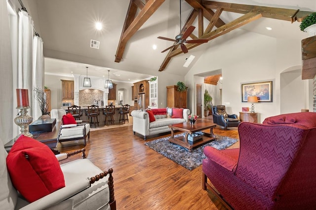 2725 Open Range Rd, Edmond, OK 73034 - living area with wood finished floors, ceiling fan, beam ceiling, high vaulted ceiling, and recessed lighting