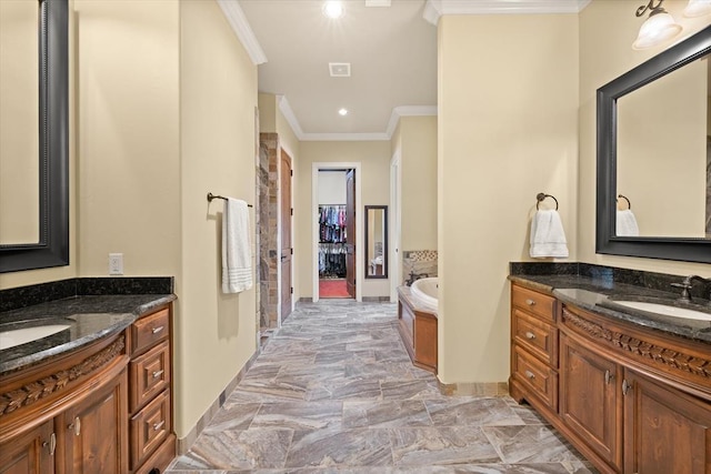 2725 Open Range Rd, Edmond, OK 73034 - bathroom featuring ornamental molding, two vanities, a garden tub, recessed lighting, and marble finish floors