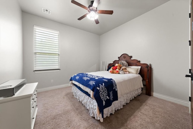 2725 Open Range Rd, Edmond, OK 73034 - bedroom with light colored carpet and a ceiling fan