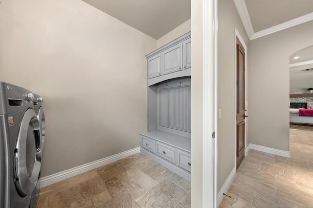 2725 Open Range Rd, Edmond, OK 73034 - laundry room with separate washer and dryer, cabinet space, light stone finish floors, crown molding, and a fireplace