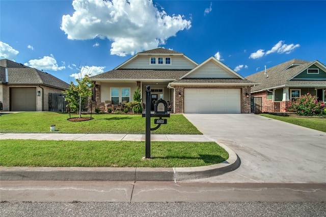 6605 NW 150th Ter, Oklahoma City, OK 73142 - craftsman-style home featuring concrete driveway, brick siding, an attached garage, and a front lawn