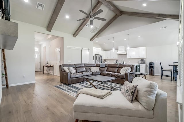 6605 NW 150th Ter, Oklahoma City, OK 73142 - living area with ceiling fan, beamed ceiling, light wood-style floors, recessed lighting, and high vaulted ceiling