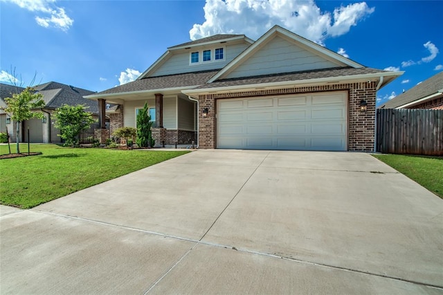 6605 NW 150th Ter, Oklahoma City, OK 73142 - view of front of property with concrete driveway, brick siding, and an attached garage