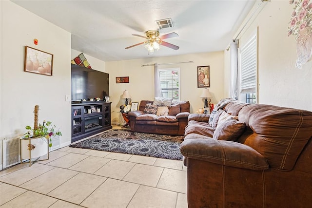 329 SE 58th St, Oklahoma City, OK 73129 - living room featuring a ceiling fan and light tile patterned flooring