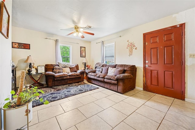 329 SE 58th St, Oklahoma City, OK 73129 - living room featuring ceiling fan and light tile patterned floors