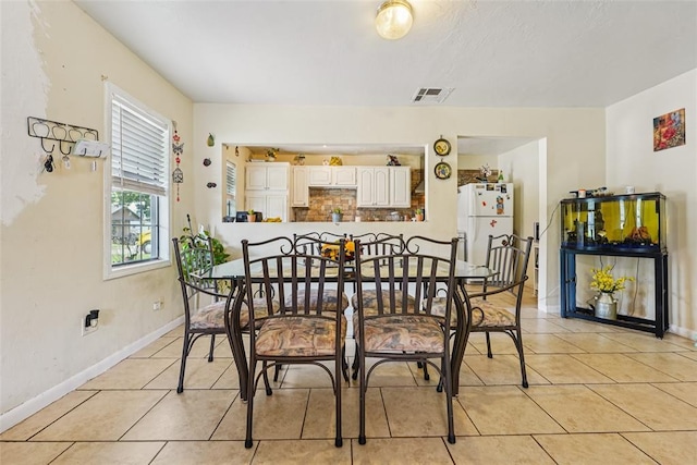 329 SE 58th St, Oklahoma City, OK 73129 - dining area with light tile patterned floors and baseboards