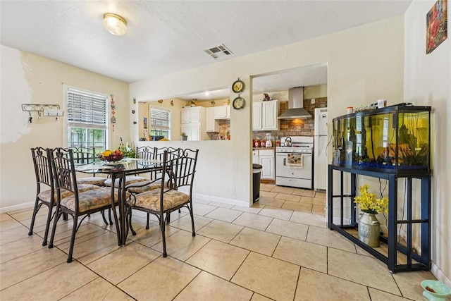 329 SE 58th St, Oklahoma City, OK 73129 - dining room featuring light tile patterned flooring and baseboards