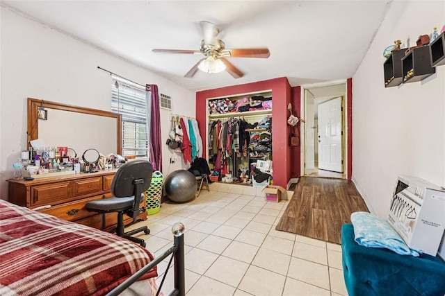 329 SE 58th St, Oklahoma City, OK 73129 - bedroom with a closet, light tile patterned flooring, and ceiling fan