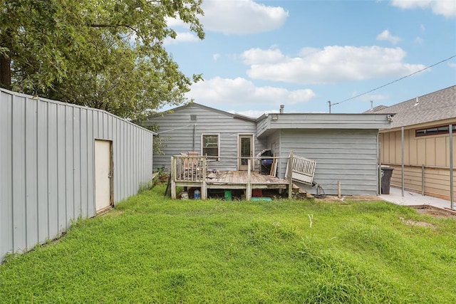 329 SE 58th St, Oklahoma City, OK 73129 - rear view of property with a yard and a deck