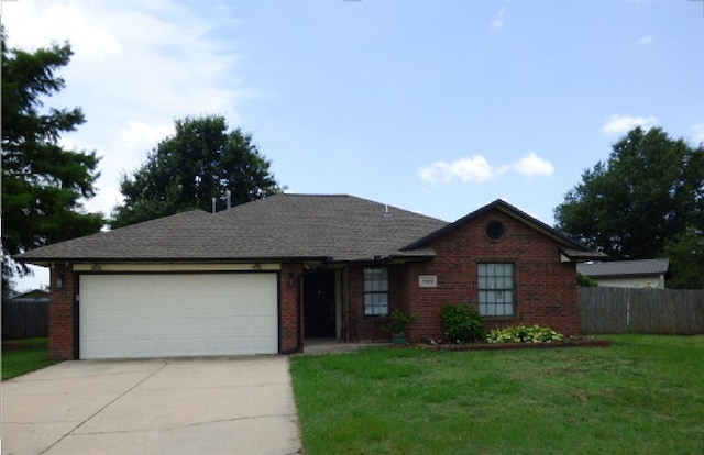 15209 Megan Cir, Oklahoma City, OK 73170 - ranch-style home with concrete driveway, a garage, and brick siding
