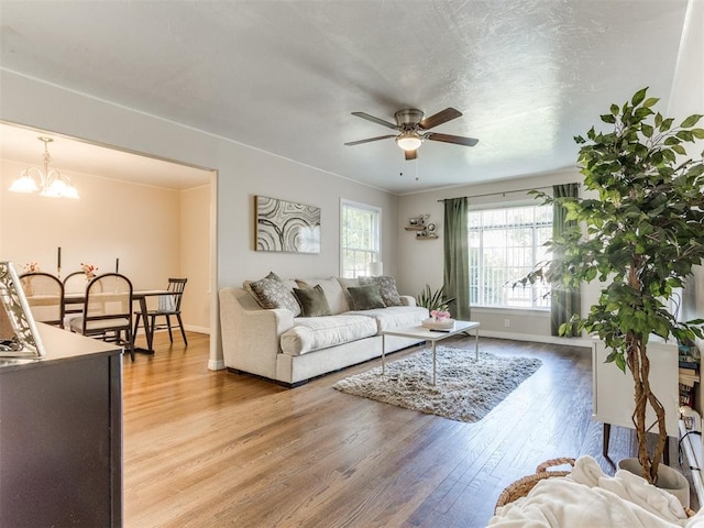 5409 N Walker Ave, Oklahoma City, OK 73118 - living area with a ceiling fan, light wood-style floors, and a chandelier