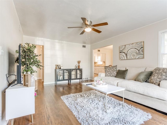 5409 N Walker Ave, Oklahoma City, OK 73118 - living room featuring ceiling fan and wood finished floors
