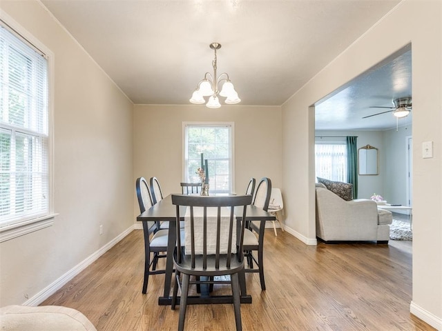 5409 N Walker Ave, Oklahoma City, OK 73118 - dining room with a chandelier, light wood-style flooring, and a ceiling fan